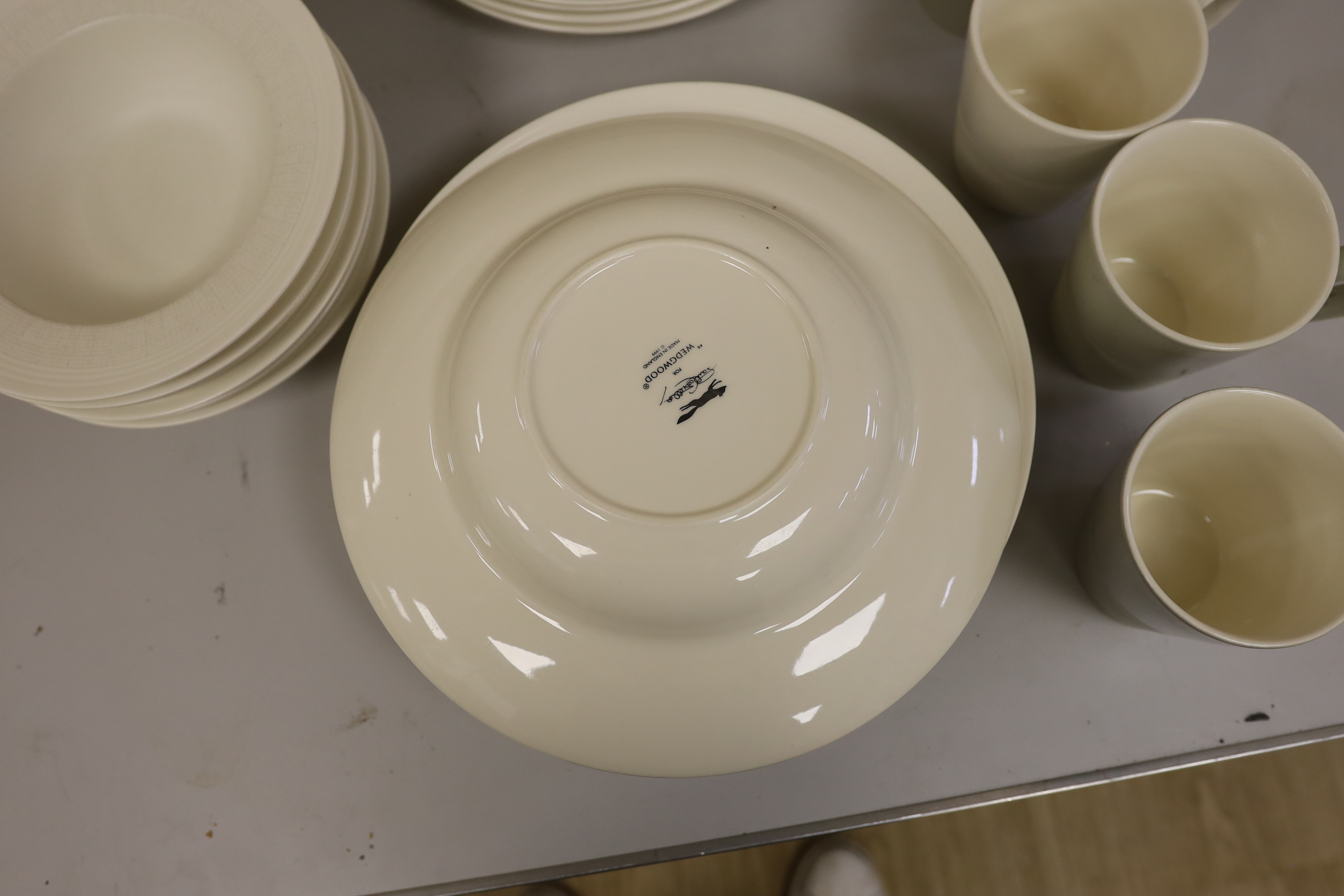 Paul Costelloe for Wedgwood, a part dinner set including six mugs, six bowls and eight dinner plates